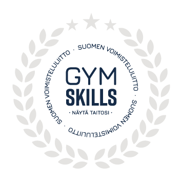 Gyms Skills hopeamitali. Keskellä on teksti GYM SKILLS ja sen alla slogan "Näytä taitosi". Tekstiä ympäröi hopea lehtiseppele.